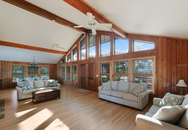 living room featuring beam ceiling and light wood-type flooring