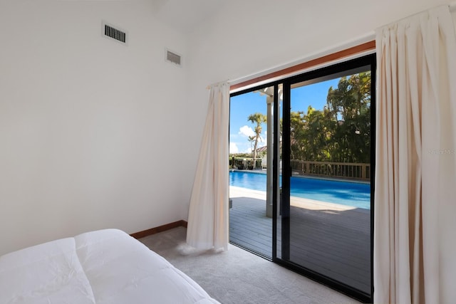 carpeted bedroom featuring access to exterior