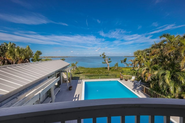 view of pool with a water view