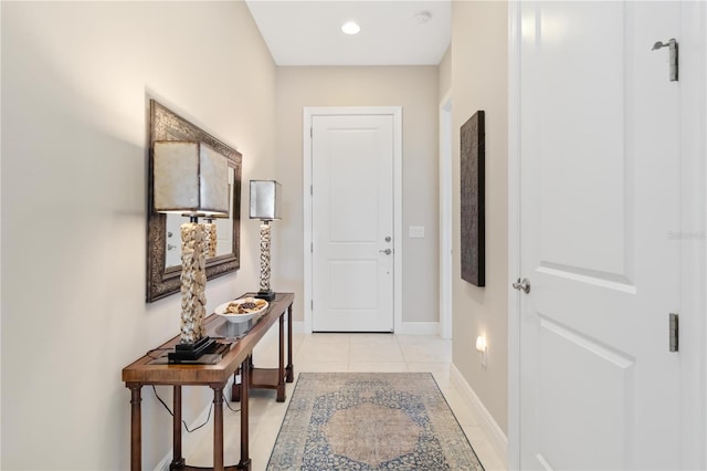 corridor featuring light tile patterned floors