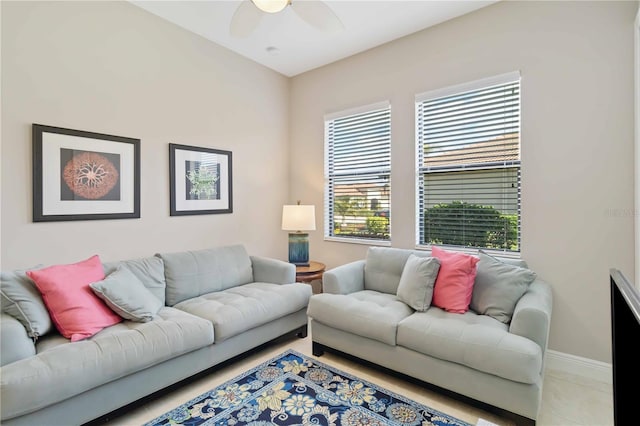 tiled living room with ceiling fan