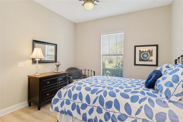 bedroom featuring ceiling fan and light hardwood / wood-style flooring