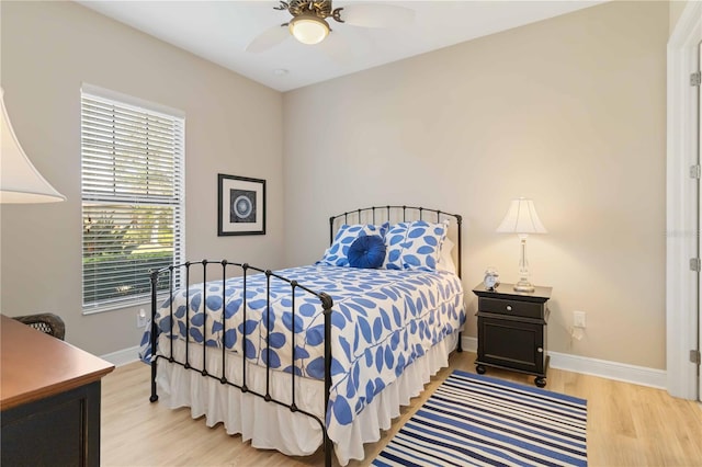 bedroom featuring light wood-type flooring and ceiling fan