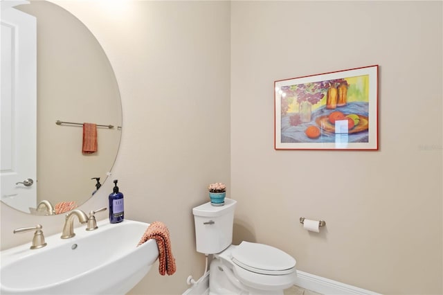 bathroom featuring sink and toilet