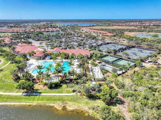 birds eye view of property with a water view