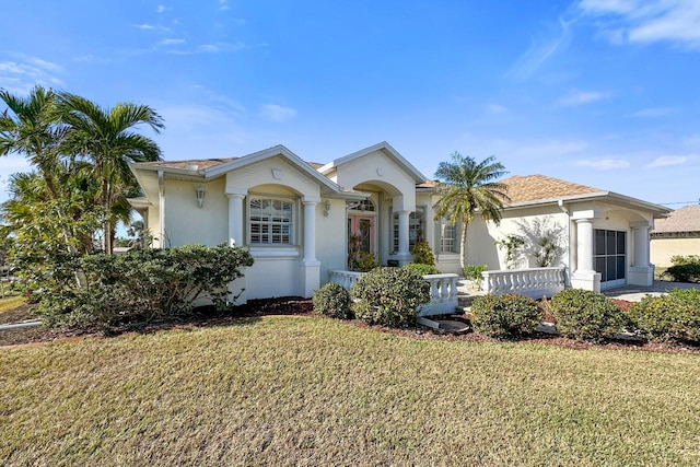 ranch-style house with a front lawn