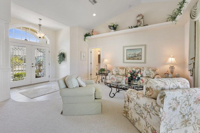 living room featuring light carpet, high vaulted ceiling, and french doors