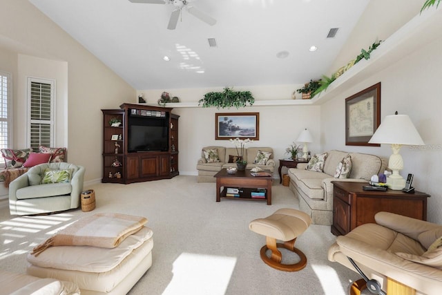 carpeted living room with vaulted ceiling and ceiling fan