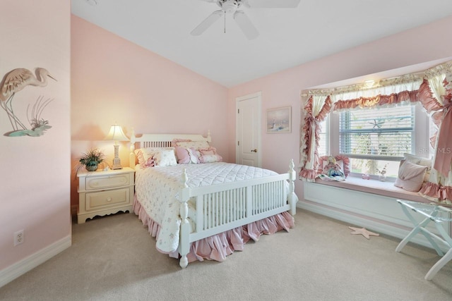 bedroom featuring lofted ceiling, light carpet, and ceiling fan