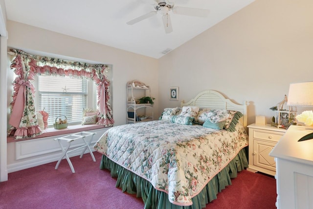 bedroom featuring ceiling fan, lofted ceiling, and dark colored carpet