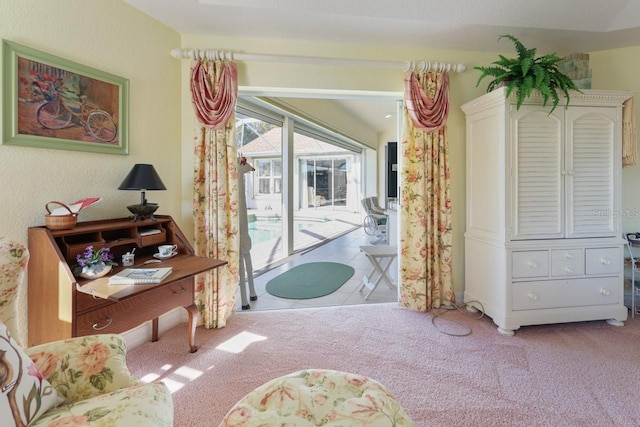 living area with light colored carpet