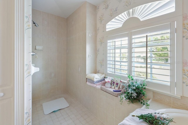 bathroom with a tile shower