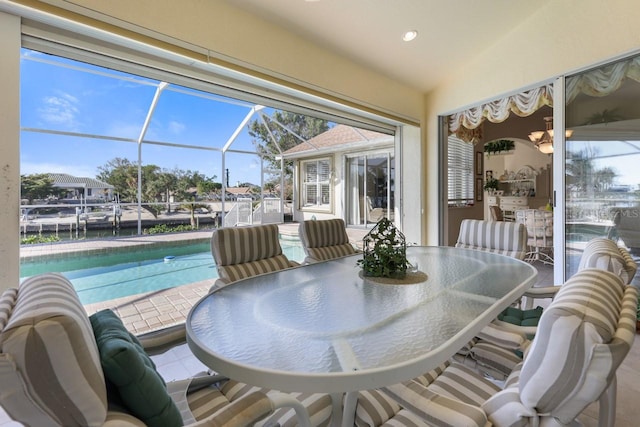 sunroom featuring lofted ceiling