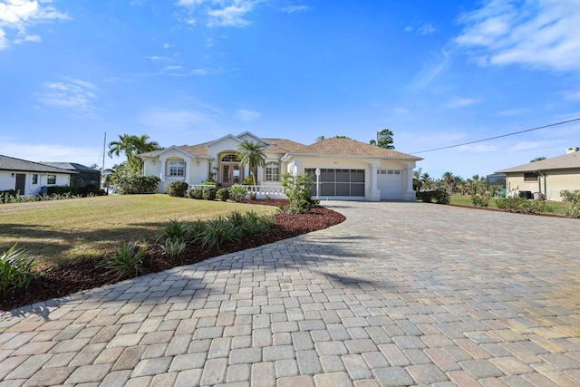 single story home with a garage and a front yard