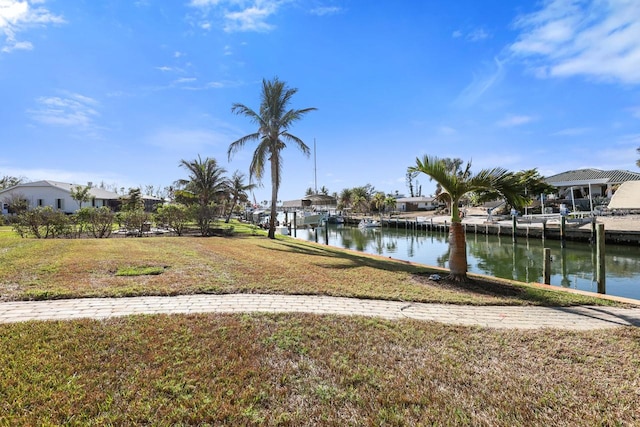 exterior space featuring a water view and a yard