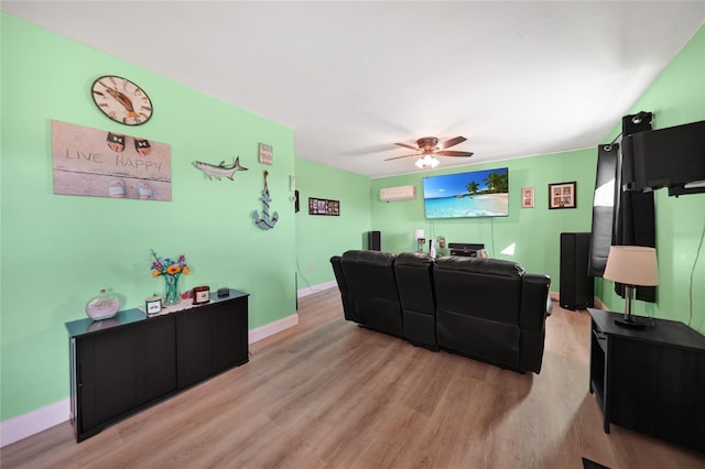 living room featuring light hardwood / wood-style floors and ceiling fan