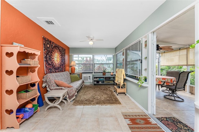 sunroom with ceiling fan