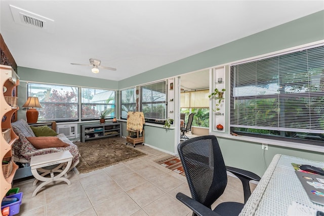 sunroom featuring ceiling fan