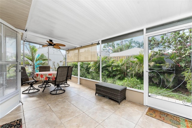 sunroom with a wealth of natural light and ceiling fan