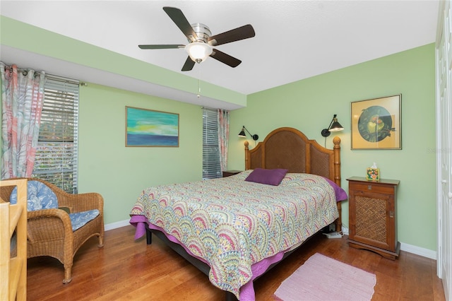 bedroom with ceiling fan and wood-type flooring