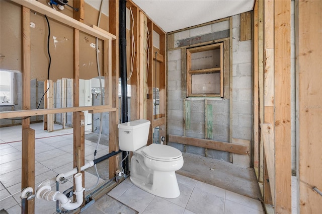 bathroom with tile patterned floors and toilet