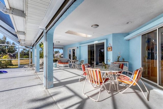 view of patio with a lanai