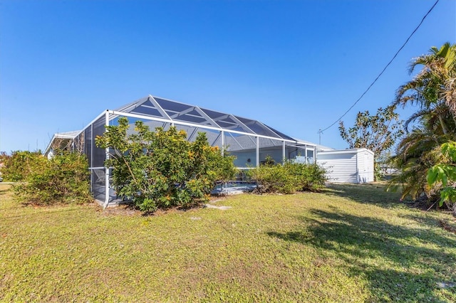 view of yard with glass enclosure