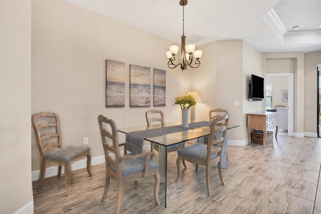 dining space with a chandelier and light wood-type flooring