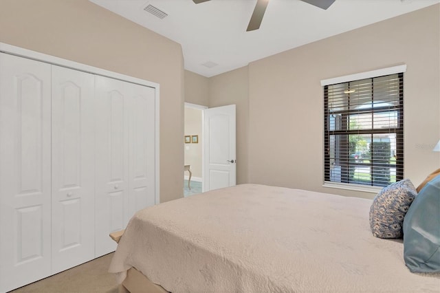 bedroom featuring ceiling fan, a closet, and carpet floors