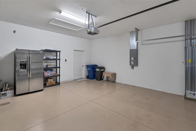 garage with stainless steel fridge with ice dispenser, electric panel, and a garage door opener