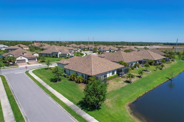 birds eye view of property featuring a water view