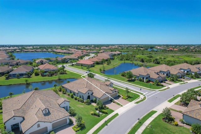 drone / aerial view featuring a water view