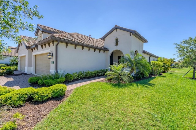 view of front facade with a front lawn and a garage