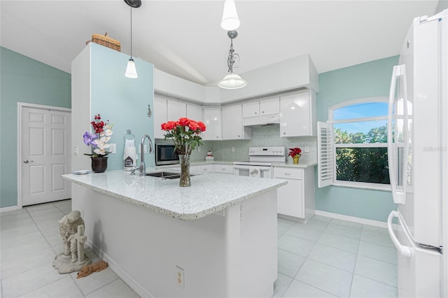 kitchen with decorative light fixtures, white cabinets, decorative backsplash, kitchen peninsula, and white appliances