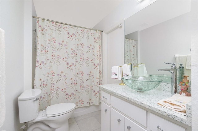 bathroom with vanity, tile patterned floors, and toilet