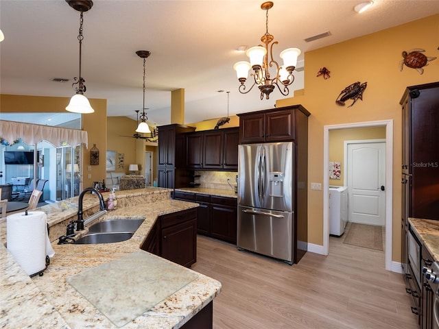 kitchen with dark brown cabinetry, stainless steel fridge with ice dispenser, sink, and decorative light fixtures