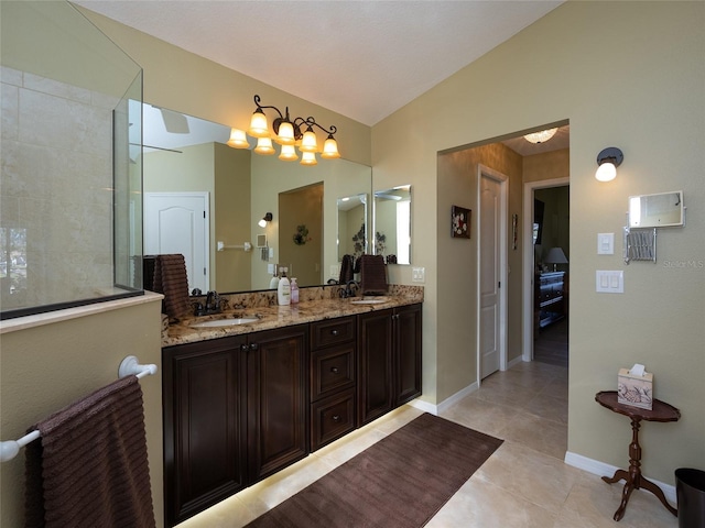 bathroom featuring vanity, tile patterned floors, and lofted ceiling