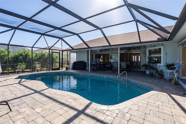 view of pool with a patio, ceiling fan, a lanai, and a grill