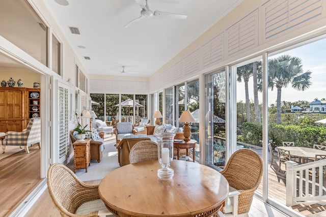 sunroom with ceiling fan and a healthy amount of sunlight