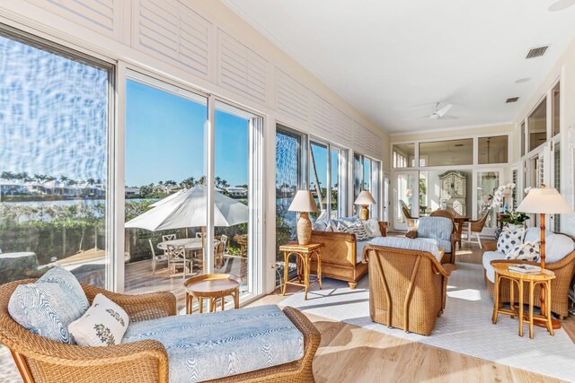 sunroom / solarium with ceiling fan