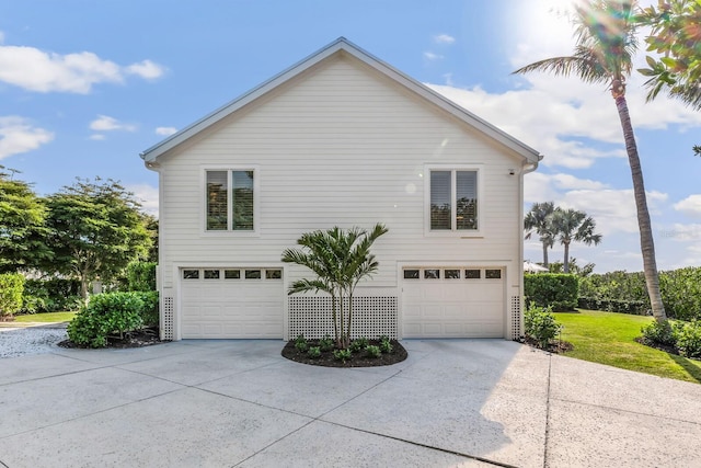 view of side of home featuring a garage