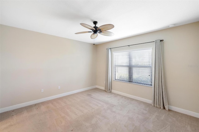 carpeted empty room with ceiling fan