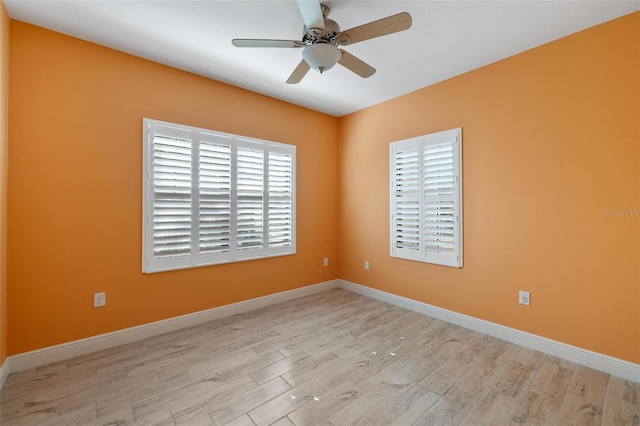 spare room featuring ceiling fan and light hardwood / wood-style floors