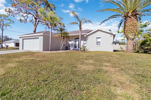 single story home featuring a front lawn and a garage