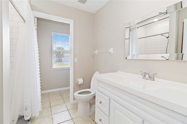 bathroom with tile patterned floors, vanity, curtained shower, and toilet