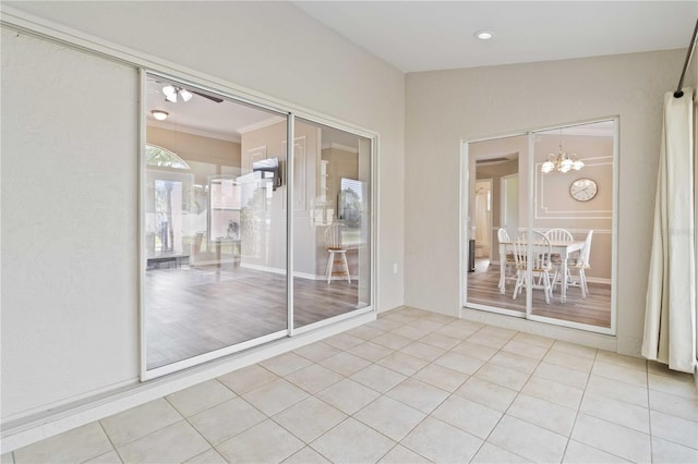 interior space with an inviting chandelier and light hardwood / wood-style flooring