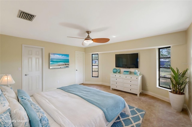 bedroom with light tile patterned floors and ceiling fan