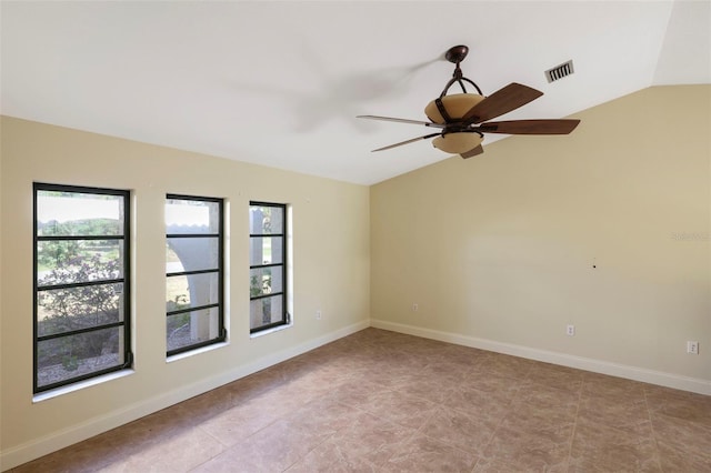 unfurnished room with ceiling fan and vaulted ceiling