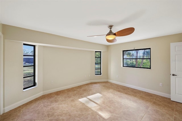 spare room with ceiling fan