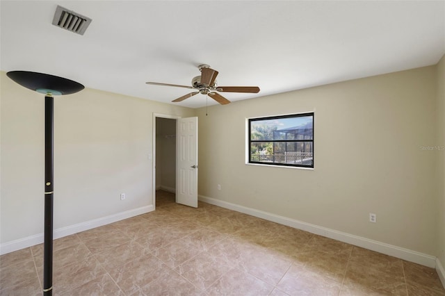 spare room with ceiling fan